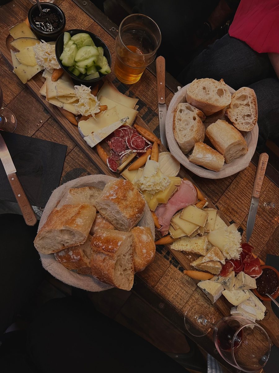 Premium cheese board with breads, cheeses and wine