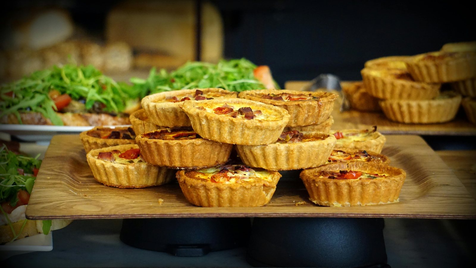 Homemade quiche displayed on a serving board